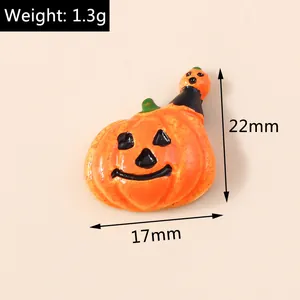 Macro view of pumpkin resin charms for DIY Halloween crafts, 22x17mm orange ornaments