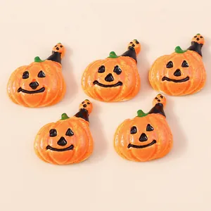 Five orange resin pumpkin charms with black witch hats for Halloween DIY crafts and decor