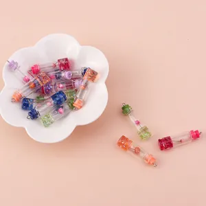 Miniature glass bottle pendants with dried flowers and colorful stoppers in 10-piece set