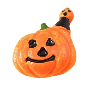 Halloween stacked pumpkin resin figurines with classic black smiling faces on white background