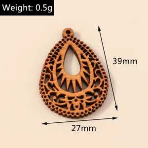 Detailed view of teardrop hollow wooden pendant with laser-cut patterns, 39x27mm size