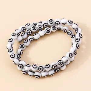 Macro shot of double-strand evil eye resin beads for DIY jewelry making and necklace crafts