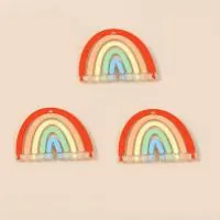 Detailed view of three acrylic rainbow charms for DIY earrings and jewelry accessories