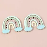 Close-up of rainbow macaron acrylic DIY charms for earrings and keychain accessories