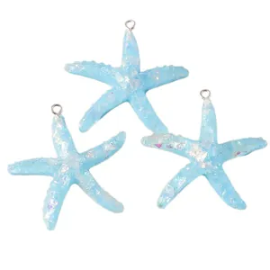 Blue resin starfish pendants with colorful glitter and silver loops on white background