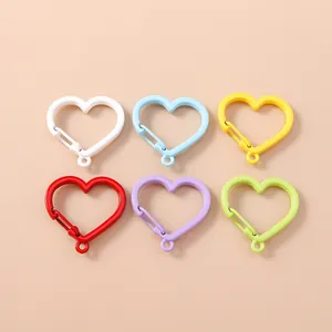 Chiusure a molla colorate a forma di cuore per accessori fai da te in varie finiture