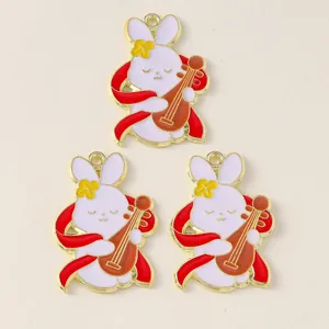 Detail of three Chinese-style rabbit charms with pipa and colorful enamel finish