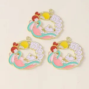 Close-up of three enamel Chinese Mid-Autumn pendants with rabbit and goddess motifs