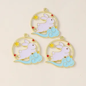 Detailed view of enamel bunny charms with clouds and stars for DIY jewelry projects