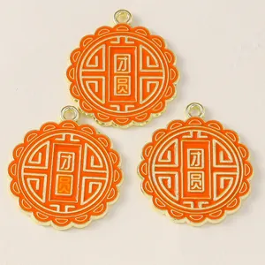 Three Chinese style round gold alloy pendants with orange enamel and Tuanyuan characters
