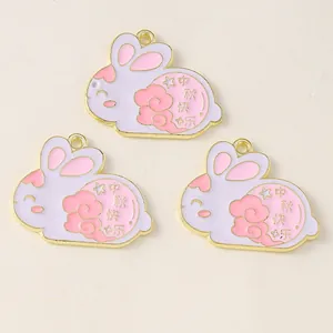 Detail view of rabbit-shaped enamel charms with Happy Mid-Autumn Festival engraving