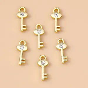 Set aus 6 goldenen Schlüsselanhängern aus Zinklegierung mit Kristall-Strasssteinen für DIY