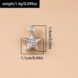 Detailed size view of a silver star charm with rhinestone showing dimensions and weight