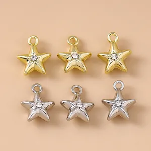 Close-up of gold and silver star pendants with rhinestones for DIY jewelry making