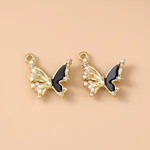 Detailed view of butterfly charms with black enamel and sparkling rhinestones for DIY jewelry