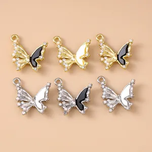 Pack of butterfly jewelry charms with inlaid rhinestones and pearls for DIY crafts