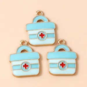Three light blue enamel medical kit charms with gold plating for jewelry making
