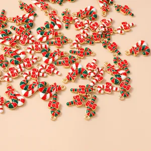Detail of candy cane alloy pendants with red and green enamel for DIY jewelry making