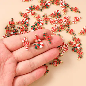Macro shot of candy cane charms with red bows for DIY Christmas jewelry making