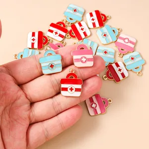 Detailed view of colorful enamel medical box charms for DIY jewelry making sets