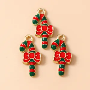 Christmas candy cane charms with red green stripes and bows for DIY jewelry making