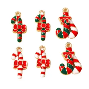 Christmas enamel charms set with red and green candy canes and decorative bows