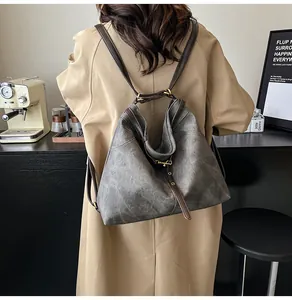 Detailed back view of a minimalist large capacity vintage tote bag on a khaki coat