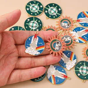Detailed view of colorful enamel space charms including shuttle and planets for jewelry making