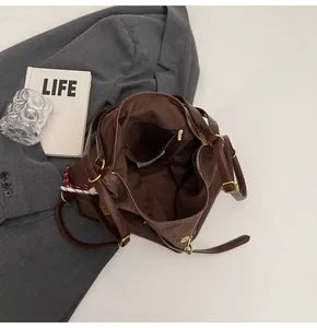 Detailed interior of the large brown tote bag showing the zipper pocket and ample storage space