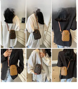 Vertical rectangular vintage monogram mobile phone bag with slim leather strap details