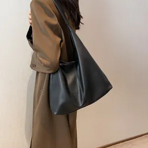 Minimalist black pebbled leather large hobo shoulder bag for women commute and daily use