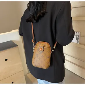 Detail view of vintage brown crossbody phone bag with FW monogram print and metal zipper