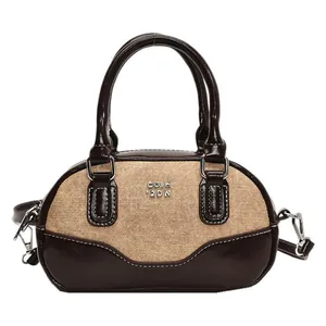 Retro contrast color bowling bag in brown leather and canvas with silver hardware