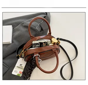 Open brown vintage bowling bag showing spacious interior capacity and premium PU leather