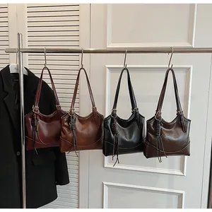 Collection of vintage oil wax leather tote bags with woven tassels in four retro colors
