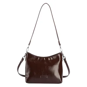 Retro minimalist dark brown glossy leather square shoulder bag with a sleek finish
