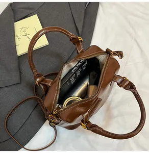 Internal view of the brown patent leather tote bag showing spacious storage for daily items
