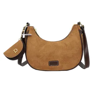 Vintage brown frosted suede crescent bag with a matching small coin pouch and golden hardware