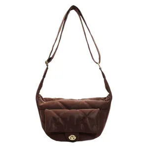 Dark brown quilted saddle bag with gold turn-lock and adjustable shoulder strap