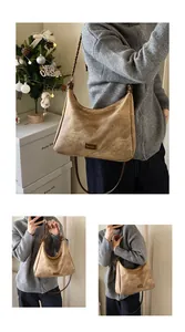 Close-up of retro brown faux suede tote bag with woven handle and fashion label