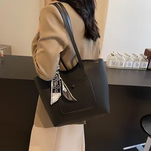 Chic black litchi grain tote bag with printed silk scarf and front buckle pocket for work