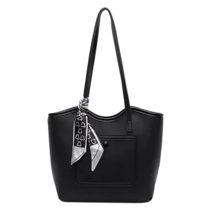 Large black lychee pattern leather tote bag with decorative black and white floral scarf