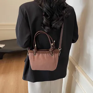 Retro brown suede bucket bag with faux fur trim and gold hardware for autumn winter