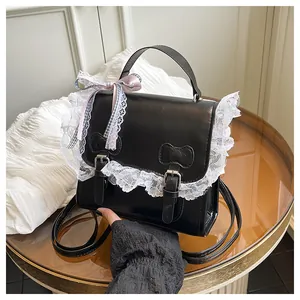 Detail of sweet lace trim on high-quality black PU leather backpack with bow accent
