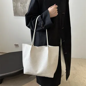 White woven texture tote bag for women shown on shoulder for professional daily commute