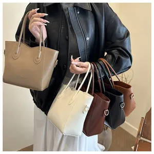 Detail showing bucket bags in khaki, ivory, chocolate, black, and caramel faux leather