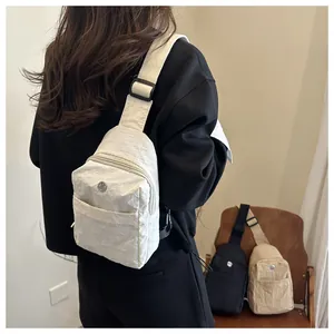 Nylon crossbody chest bag with pleated texture and adjustable strap in minimalist style