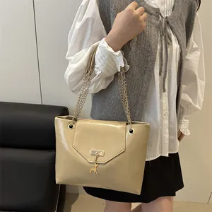 Elegant beige PU leather tote bag with deer charm and gold chain strap for women