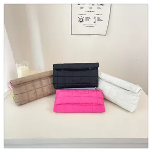 Quilted pouch set featuring large checkered pattern in khaki, black, white, and pink