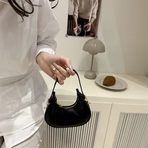 French luxury black half moon handbag with gold hardware for elegant banquet evening use